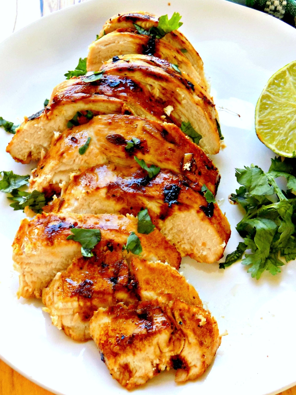 This is a photo showing a piece of Key West Chicken served on a white plate. 