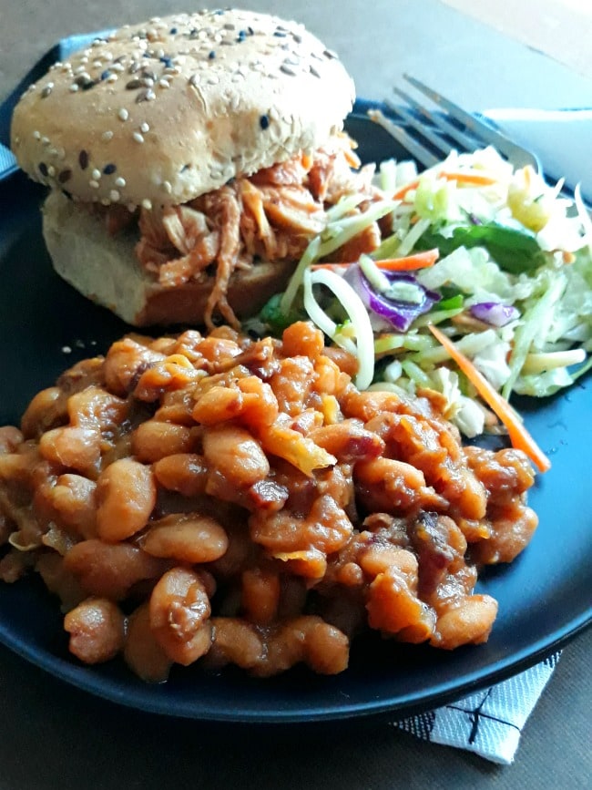 Plate with Pulled BBQ Chicken Sandwich, Coleslaw, and Amish Baked Beans