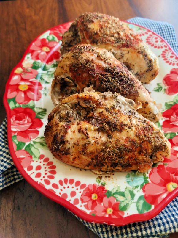 Plate of Juicy, Flavorful Split Chicken Breasts made in the slow cooker.