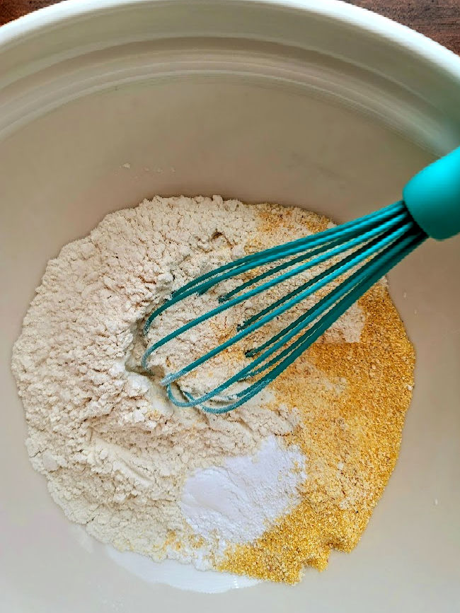 Mixing batter for maple cornbread muffins