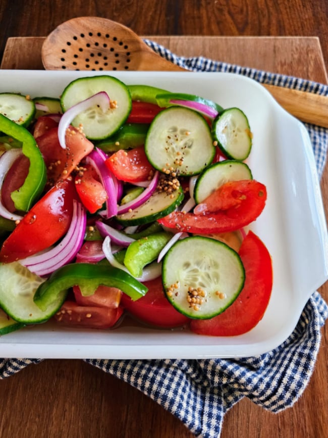 This photo shows Fire and Ice Salad in a white rectangle serving tray. 