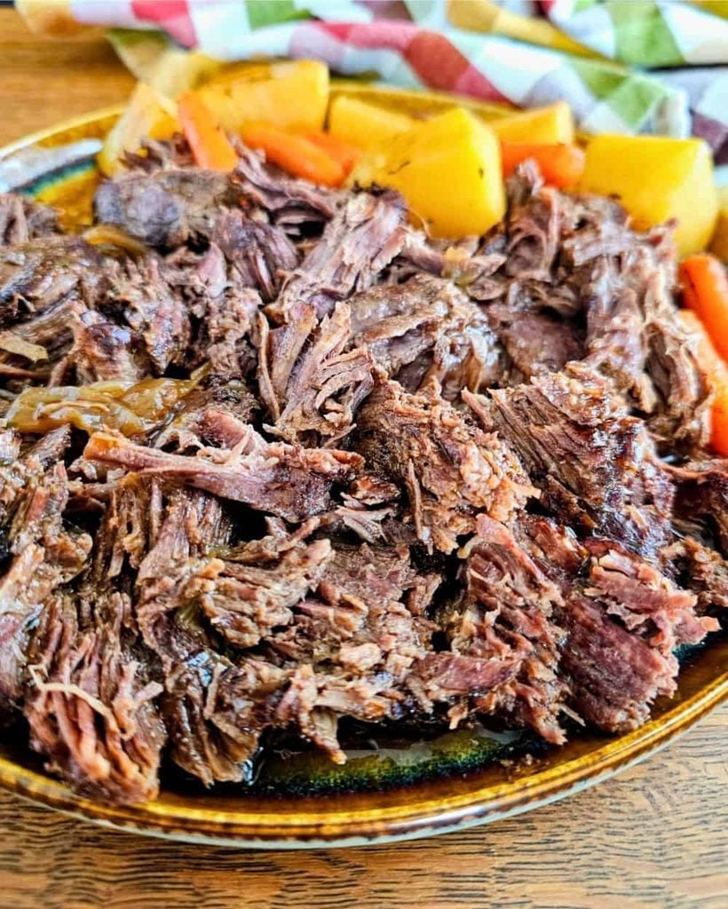 Plate of Old-Fashioned Pot Roast with Potatoes and Carrots 